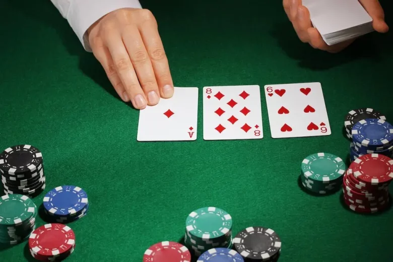 a dealer laying down the flop