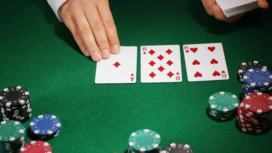a dealer laying down the flop