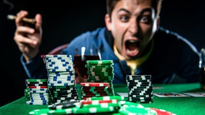 Poker player yelling at poker chips