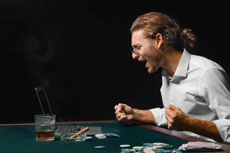 man celebrating winning a poker hand