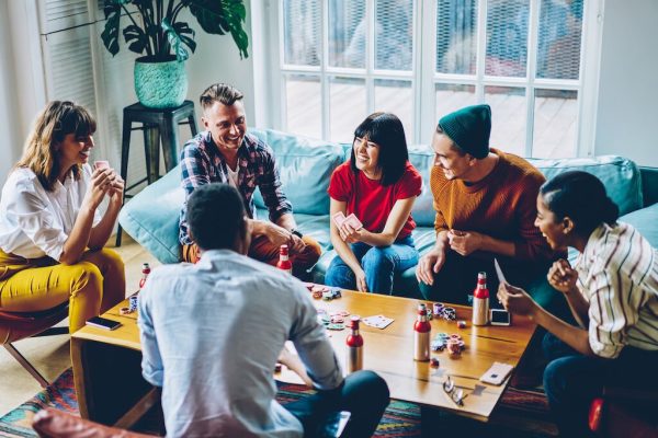 a bunch of friends playing poker at home