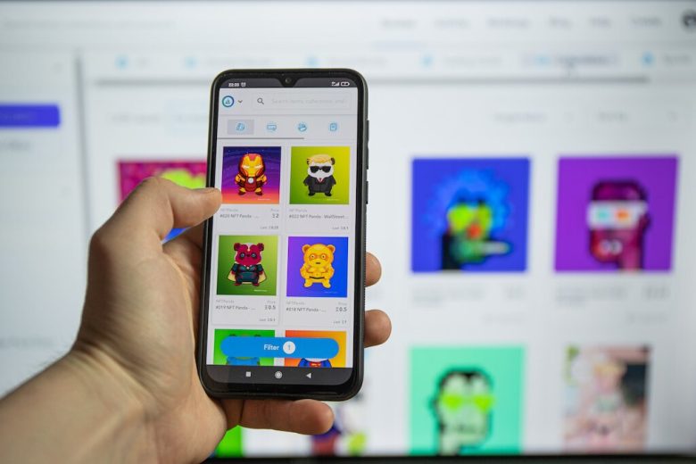 A man holding a phone with an NFT app open