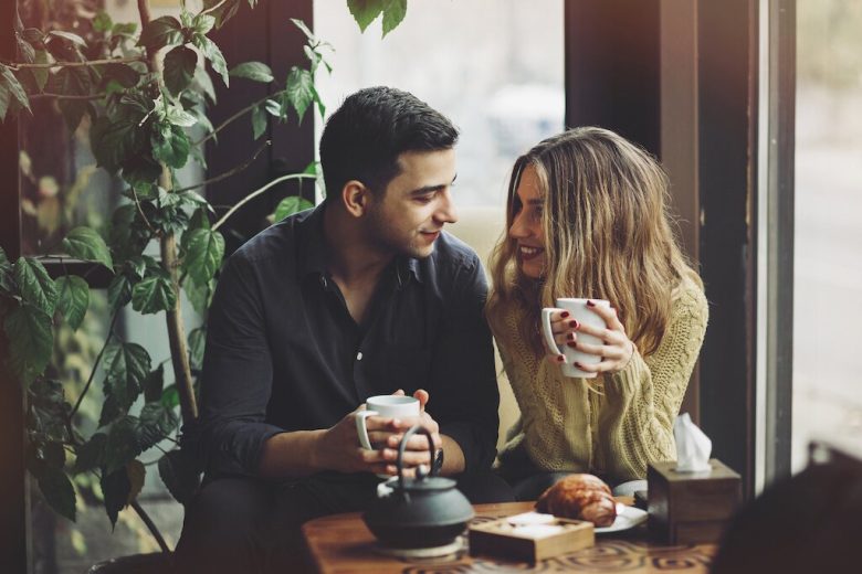 A couple drinking coffee on a date