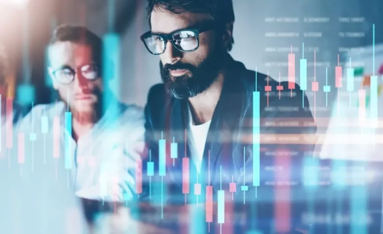 a man looking over stock charts