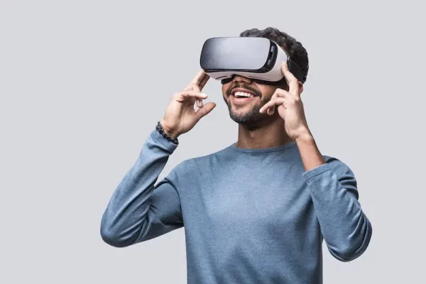 Man with blue shirt wearing a VR headset