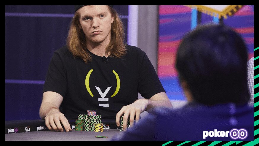 Landon Tice stacking poker chips at a poker table.