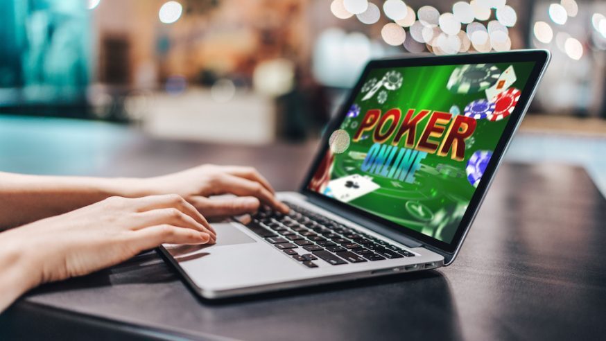 playing free online poker on a laptop