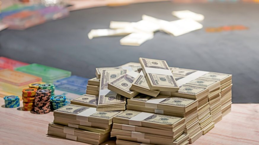 Piles of cash on poker table