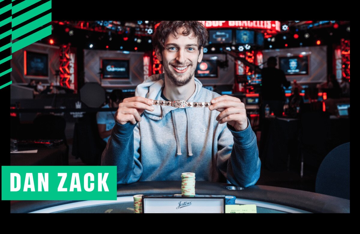 Poker player Dan Zack is smiling while holding a World Series of Poker