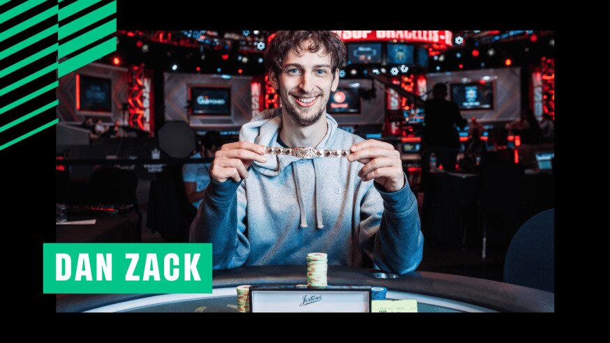Poker player Dan Zack is smiling while holding a World Series of Poker