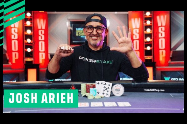 Poker player Josh Arieh holds up his WSOP bracelet in his right hand and has hang spread out on left hand to show that he has won hiss 5th WSOP Bracelet.