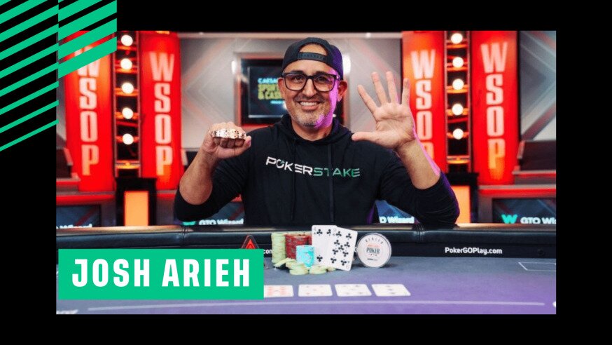 Poker player Josh Arieh holds up his WSOP bracelet in his right hand and has hang spread out on left hand to show that he has won hiss 5th WSOP Bracelet.