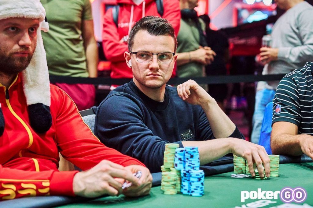 Alex Kulev staring a player down at the poker table