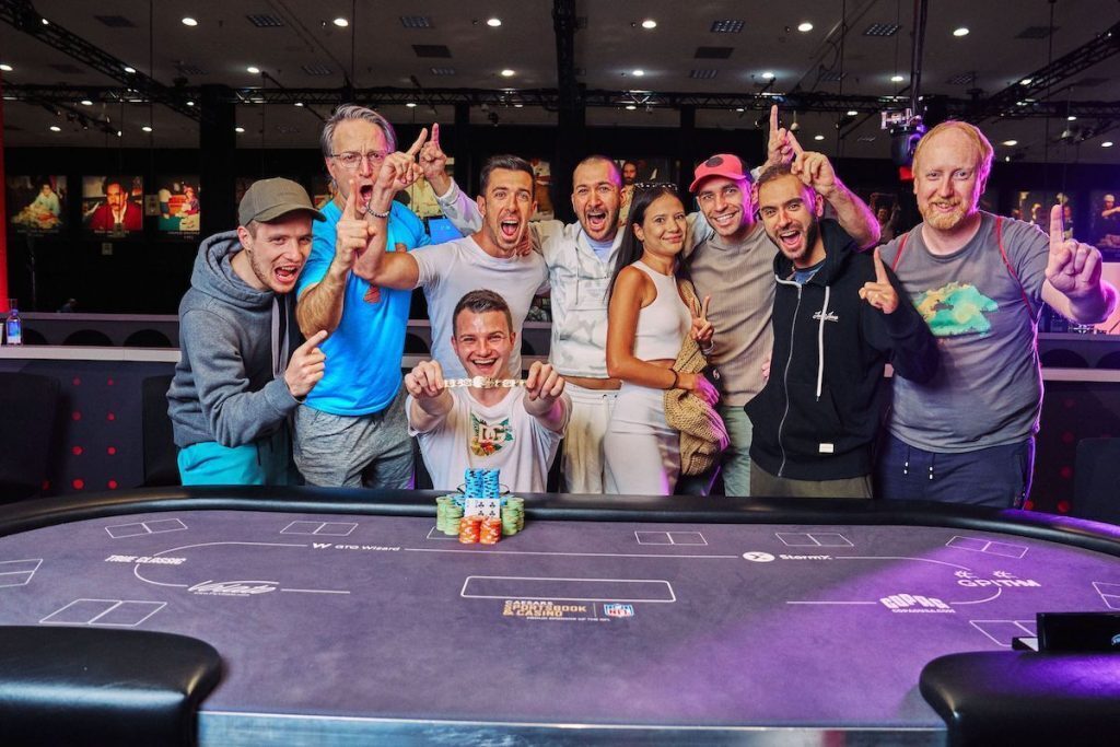Kulev Celebrates with his family and friends after winning WSOP bracelet