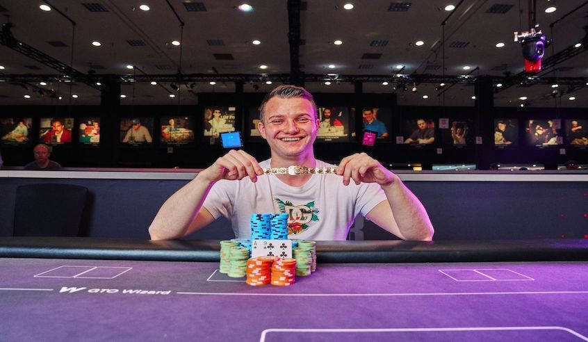 Alex Kulev holding his WSOP bracelet after high roller win