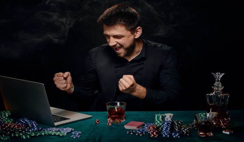 Man celebrating winning at online poker