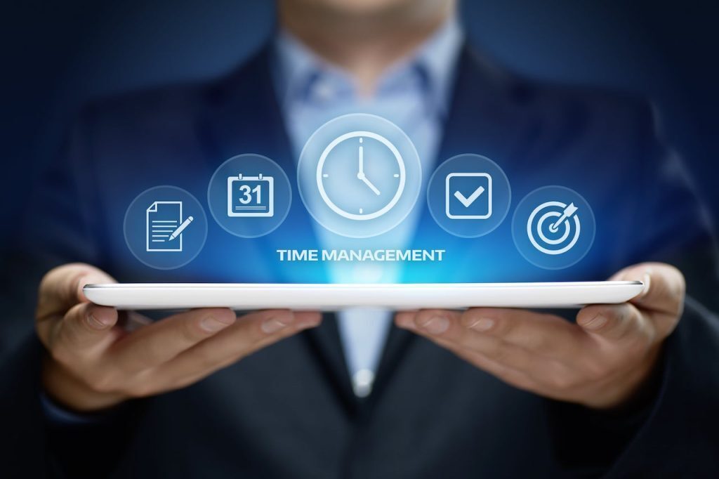 A man with a tablet for time management 