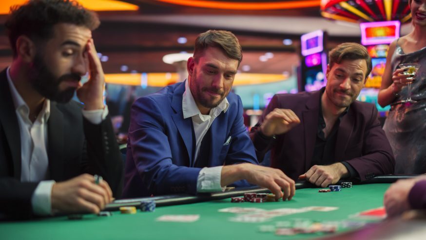 3 Guys Playing Poker with one guy changing gears