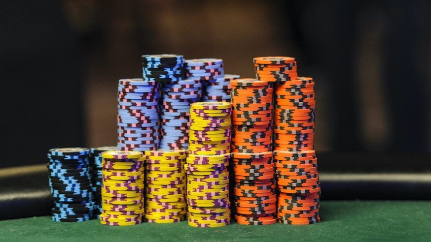 A Stack of chips of a variety of colours