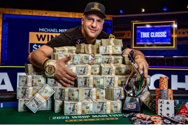 michael mizrachi in front of WSOP winnings