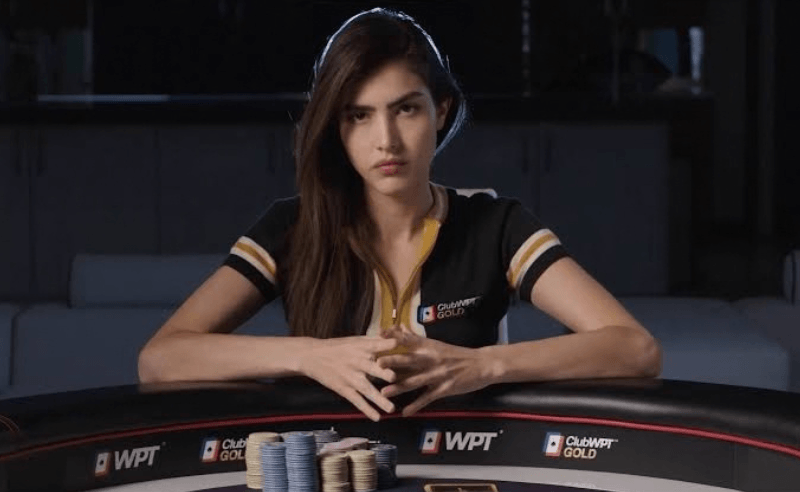 Alexandra Botez portrait in a poker table
