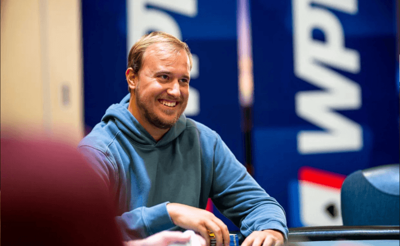 Blake Ellinghaus smiles at the poker table