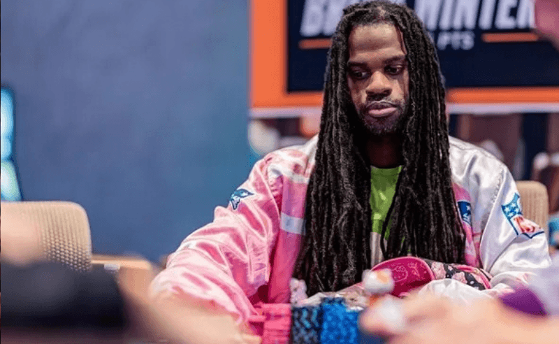 Portrait of Justin Arnwine in a poker table