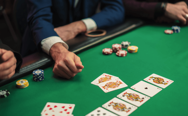 Players competing at a live poker tournament table